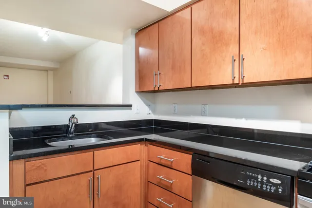 a kitchen with stainless steel appliances a stove a microwave and a refrigerator