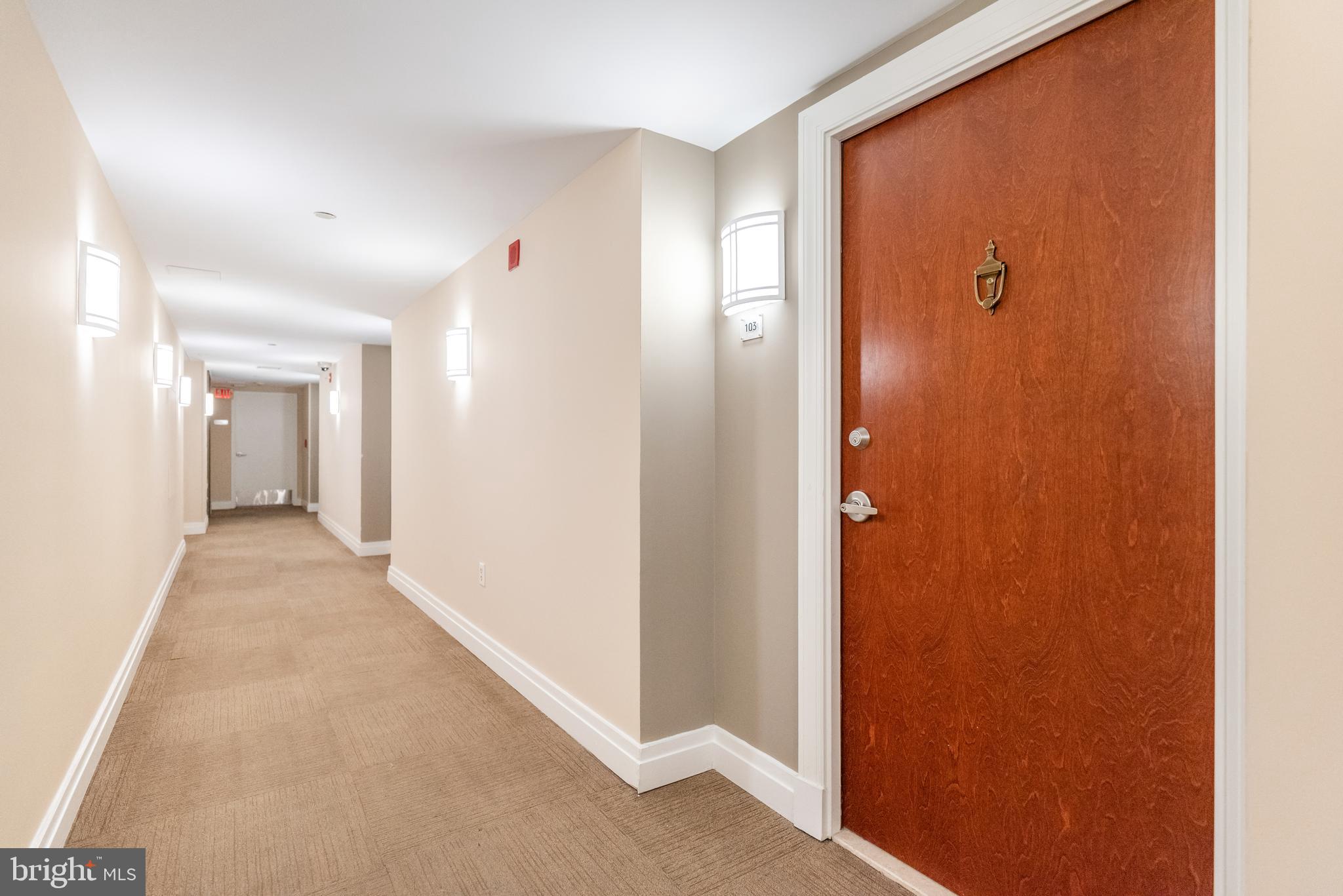 915 E Street Northwest, Unit 103 Washington, DC 20004 - Photo 29 of 43 a view of a hallway with wooden floor