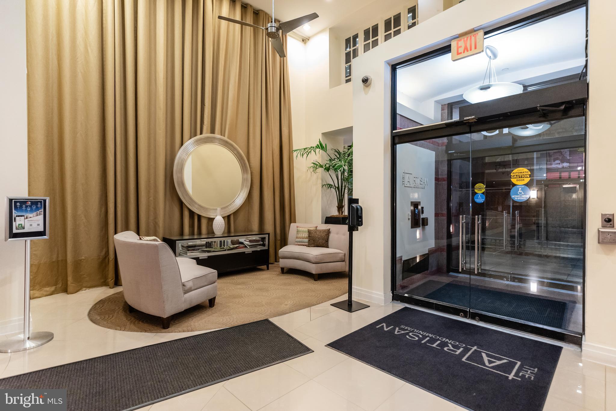 915 E Street Northwest, Unit 103 Washington, DC 20004 - Photo 32 of 43 a living room with furniture and a rug