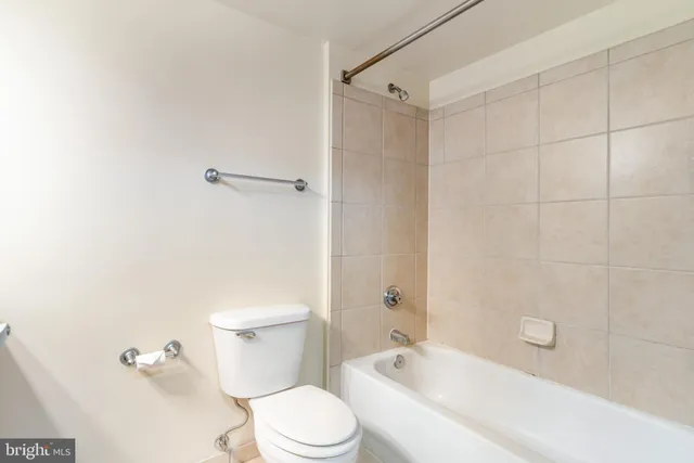 a bathroom with a shower and a bathtub