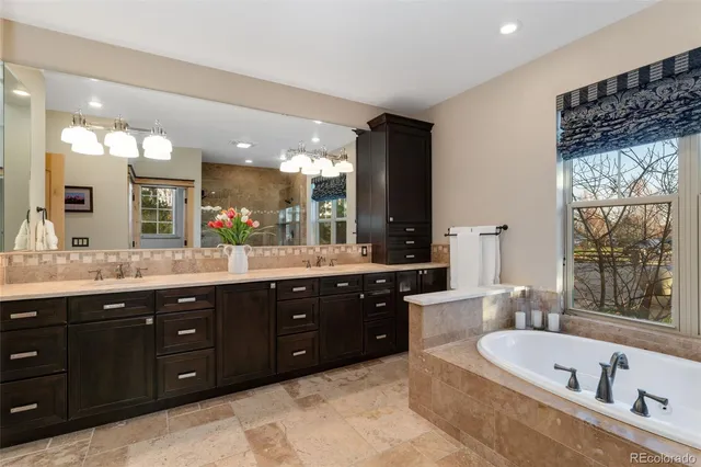 a spacious bathroom with a bathtub and shower