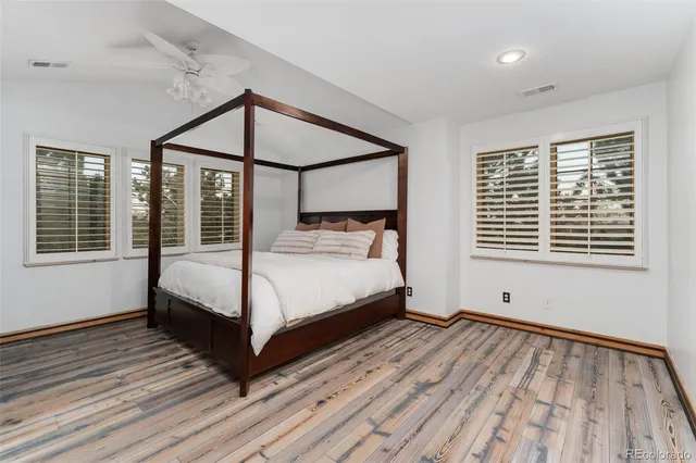 a bathroom with a double vanity sink a mirror and a shower