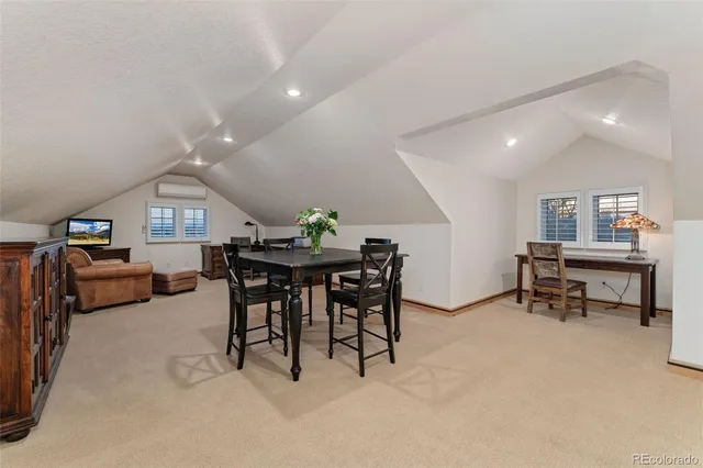 a bathroom with a toilet and a mirror