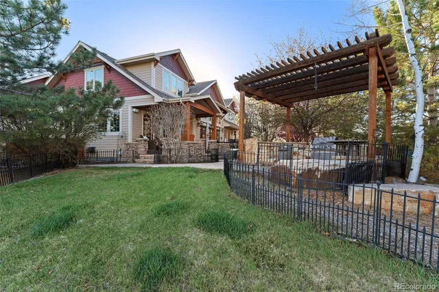 a outdoor space of a house with barbeque oven and outdoor seating