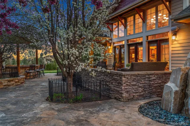 a patio with table and chairs
