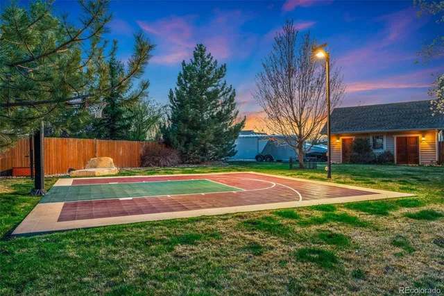 a living room with furniture a fireplace and wooden floor