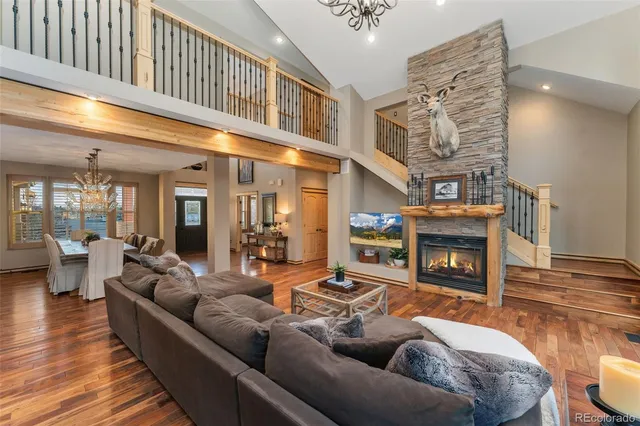 a living room with fireplace furniture and a flat screen tv