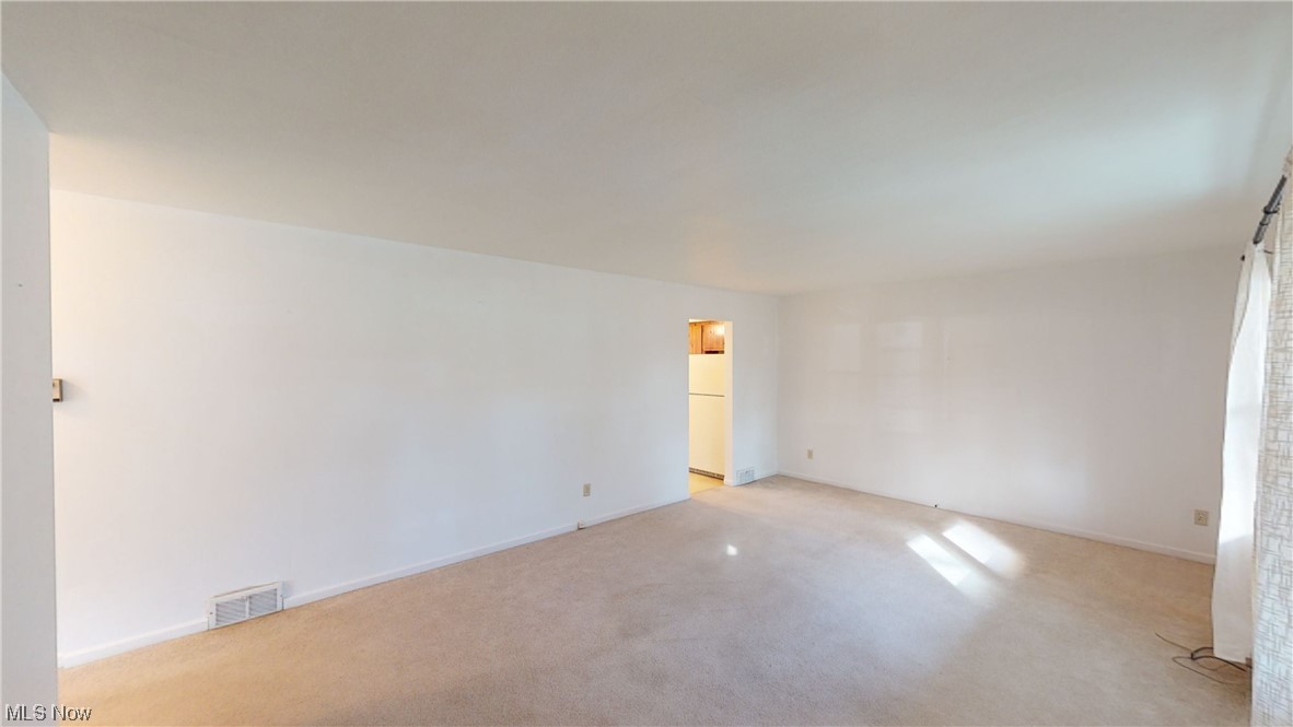 View of carpeted spare room