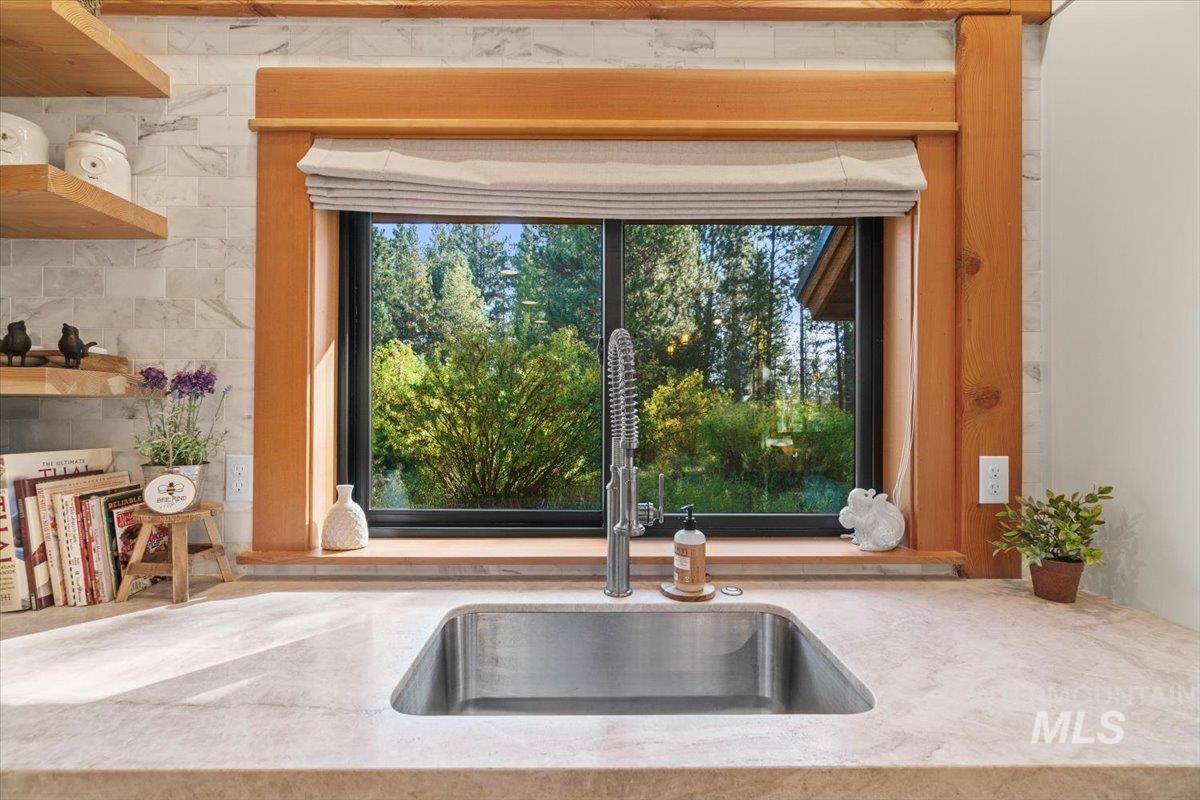 13982 Comfort Road McCall, ID 83638 - Photo 15 of 50 Kitchen view of light stone countertops