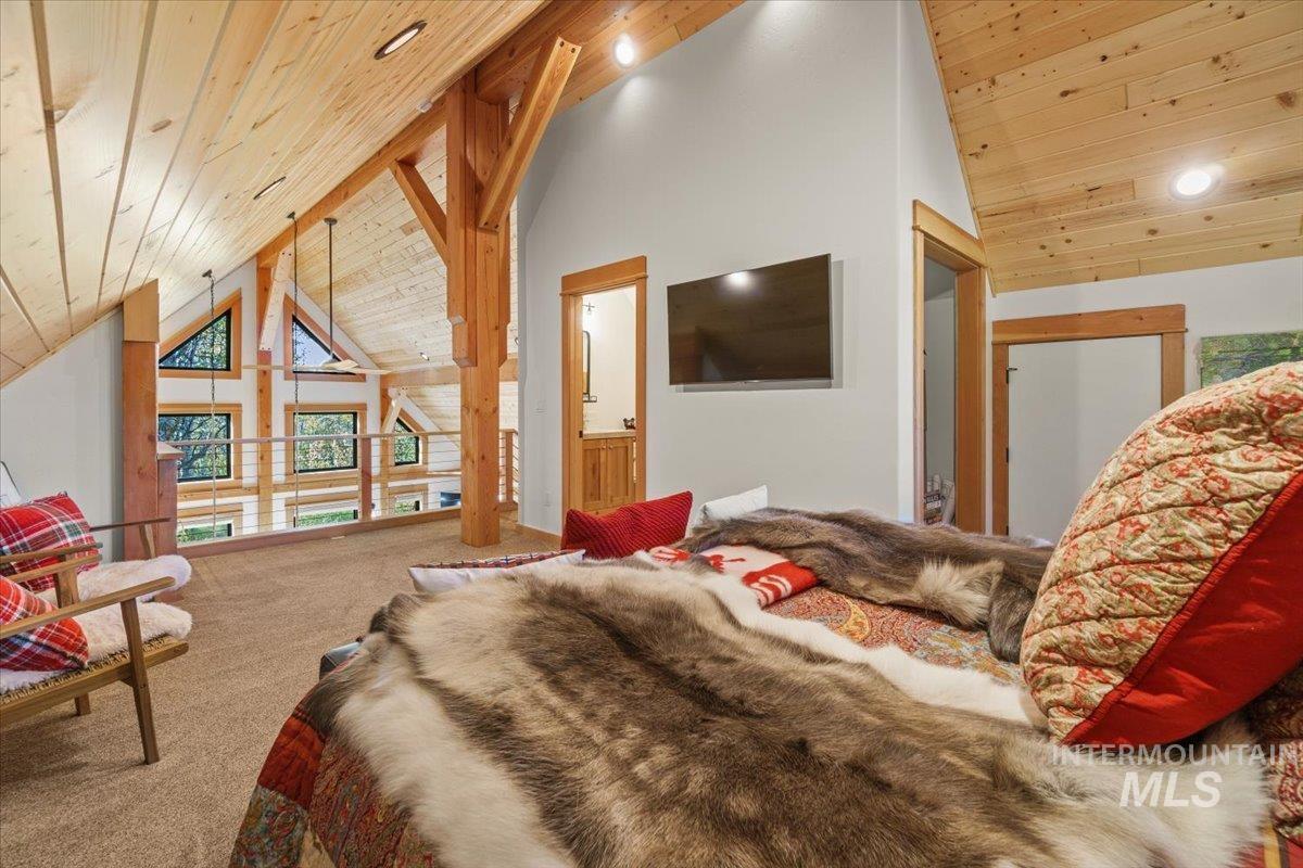 13982 Comfort Road McCall, ID 83638 - Photo 34 of 50 Carpeted bedroom featuring wooden ceiling, high vaulted ceiling, and recessed lighting