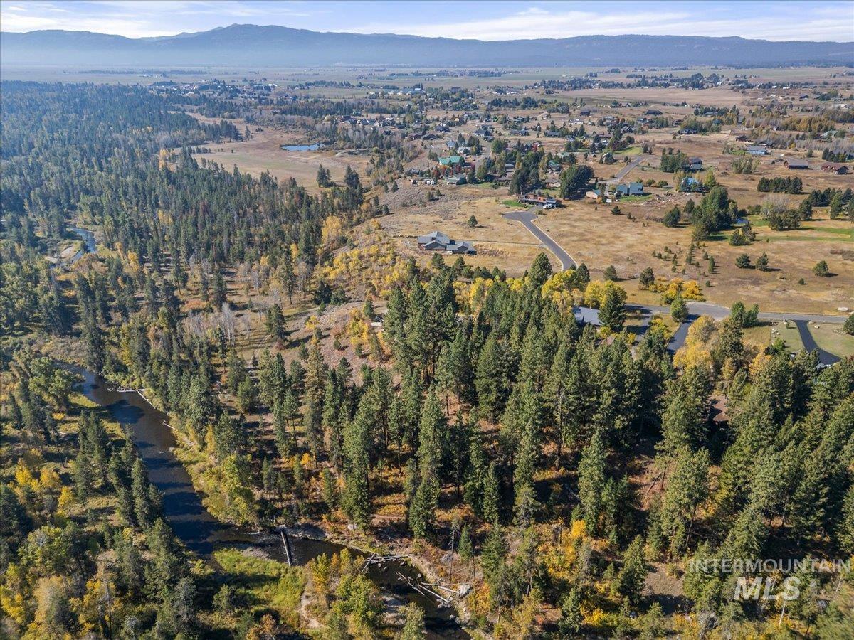 13982 Comfort Road McCall, ID 83638 - Photo 44 of 50 Aerial view of property and surrounding area with a mountainous background and a heavily wooded area