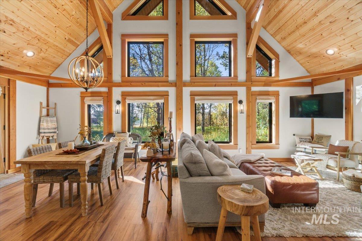 13982 Comfort Road McCall, ID 83638 - Photo 7 of 50 Sunroom featuring lofted ceiling and a chandelier