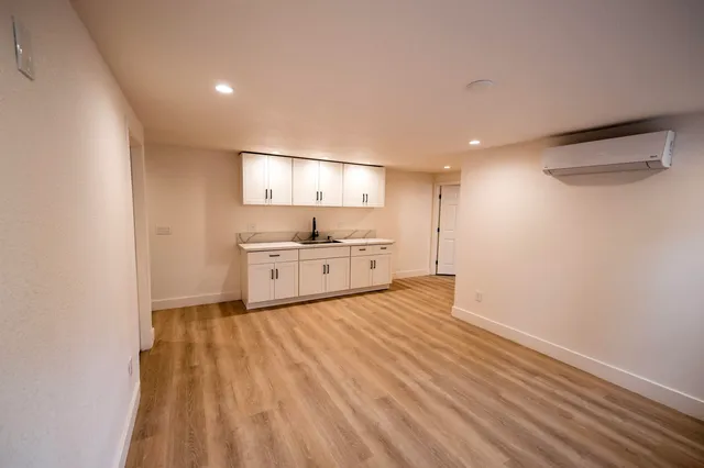 a view of kitchen with wooden floor