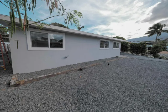 a backyard of a house with lots of green space