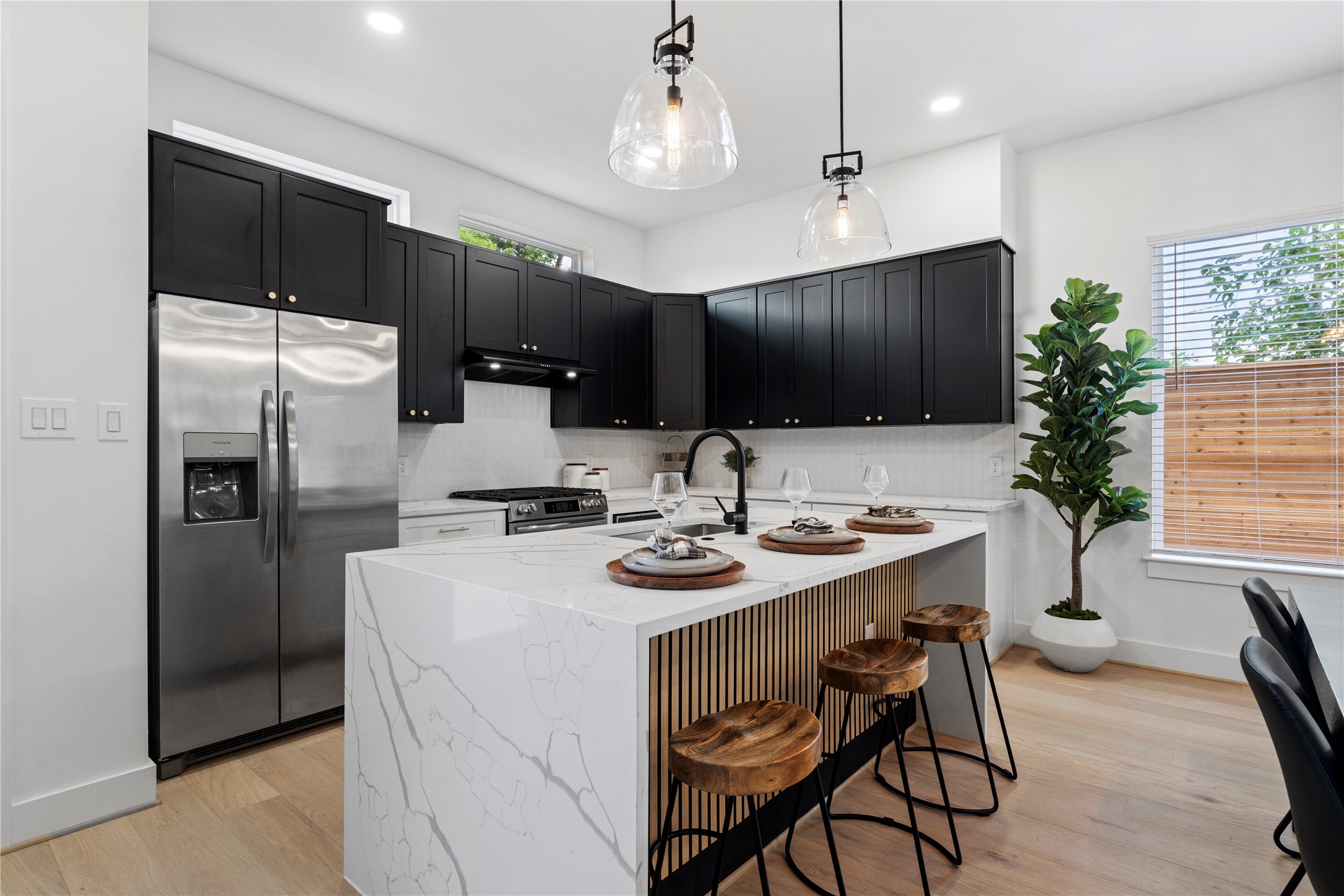 4108 Cortlandt Street Houston, TX 77022 - Photo 43 of 43 a kitchen with a sink refrigerator and microwave