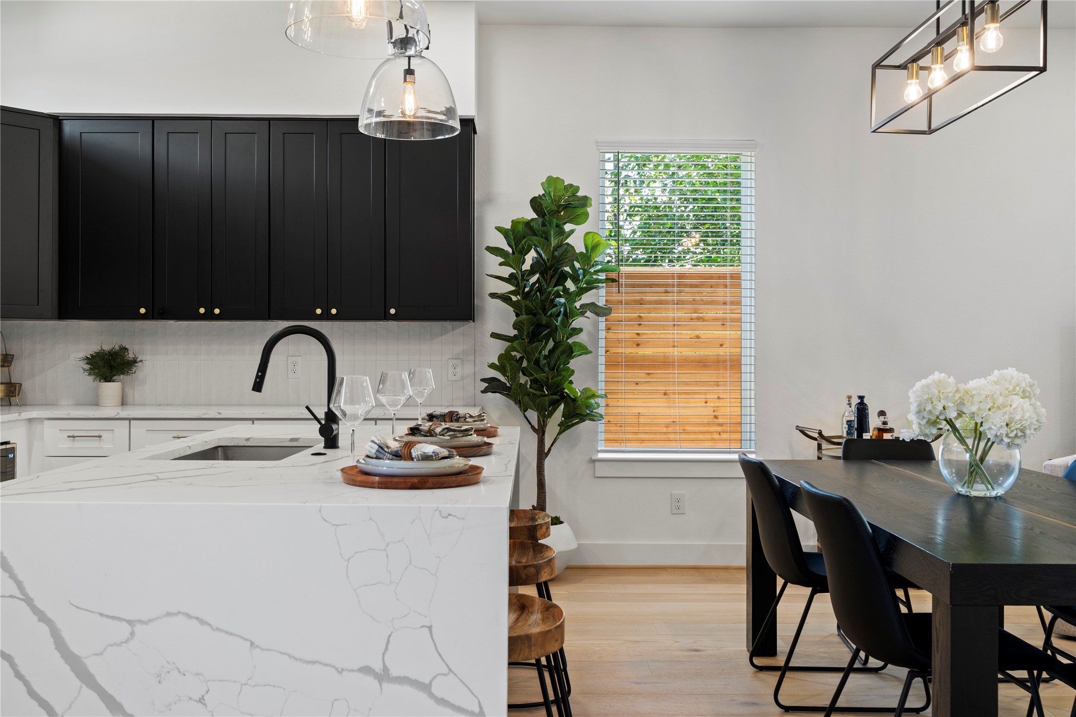 4108 Cortlandt Street Houston, TX 77022 - Photo 11 of 43 a kitchen with a table and chairs in it