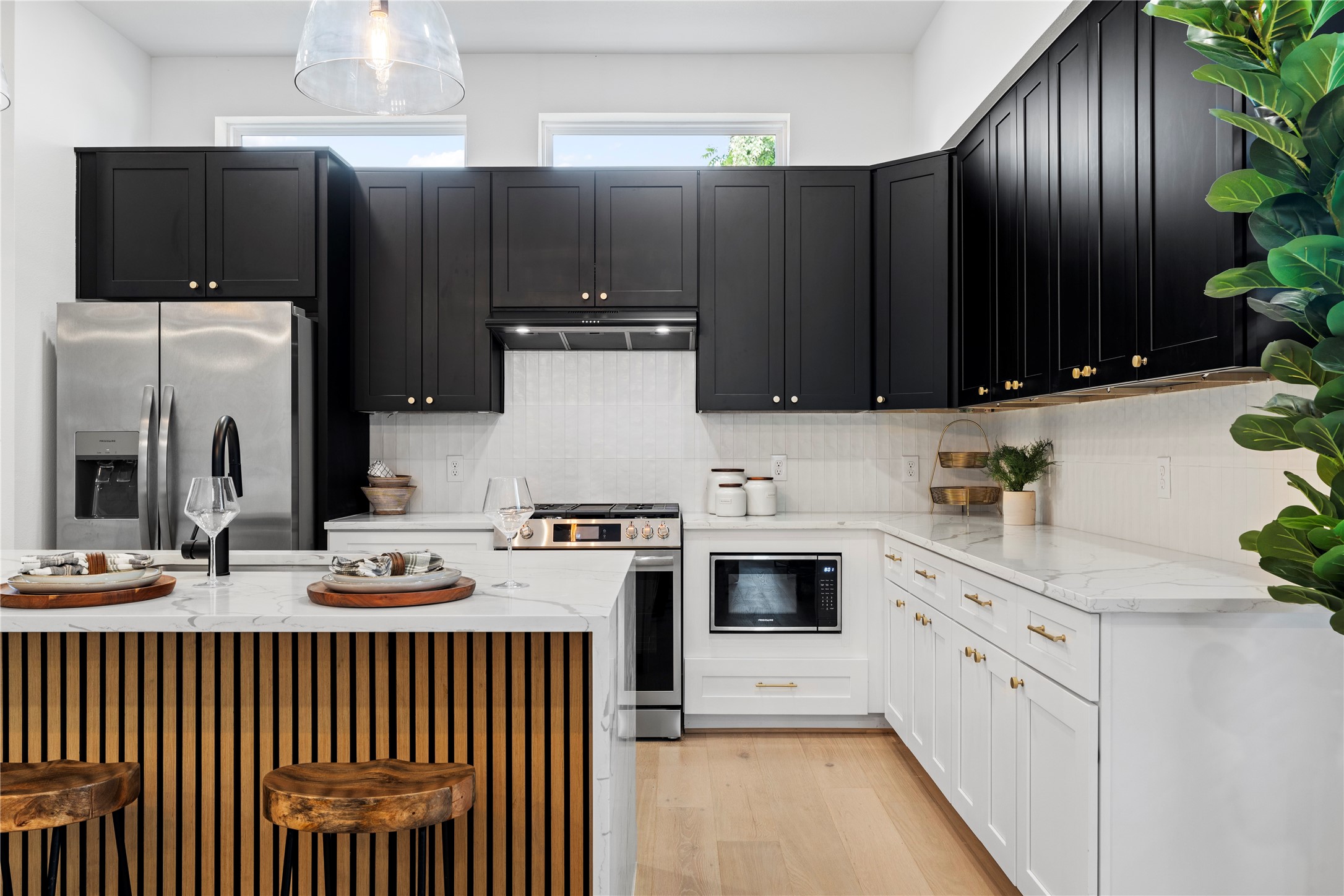 4108 Cortlandt Street Houston, TX 77022 - Photo 16 of 43 a kitchen with granite countertop a refrigerator stove and microwave