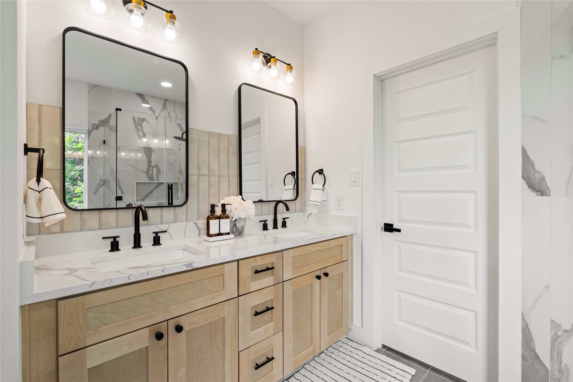 4108 Cortlandt Street Houston, TX 77022 - Photo 26 of 43 a bathroom with a double vanity sink and mirror