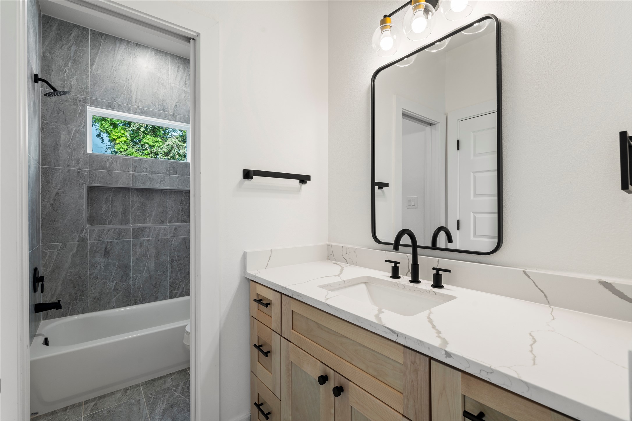 4108 Cortlandt Street Houston, TX 77022 - Photo 33 of 43 a bathroom with a sink and a mirror