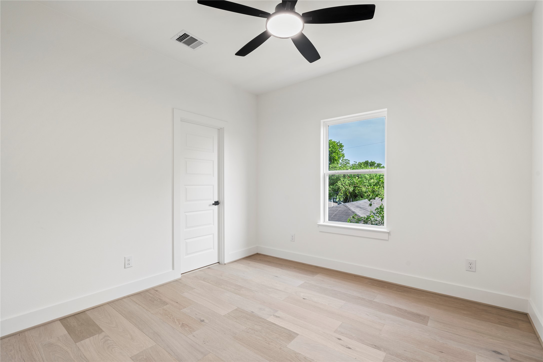 4108 Cortlandt Street Houston, TX 77022 - Photo 35 of 43 an empty room with a window and a ceiling fan