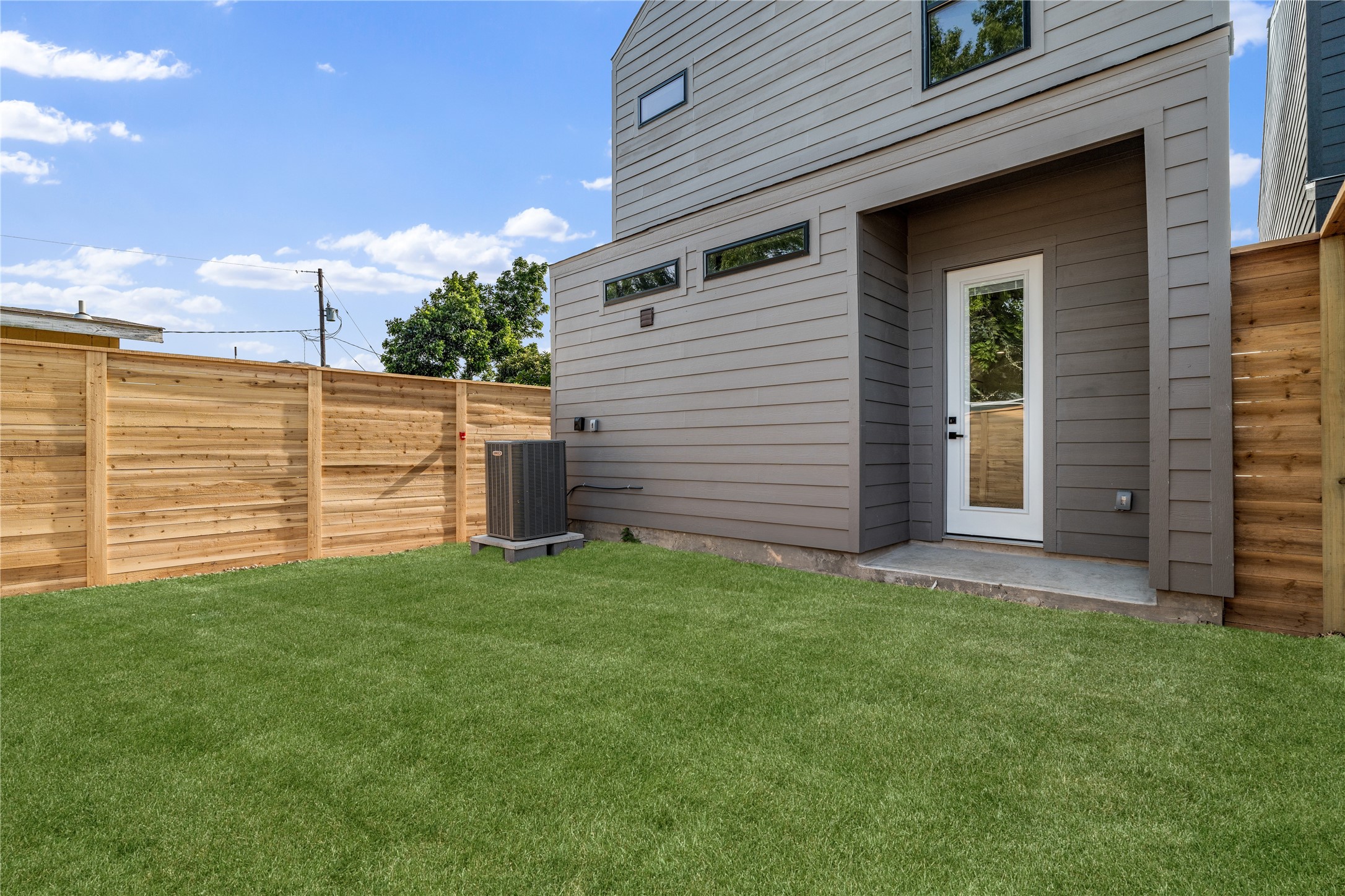 4108 Cortlandt Street Houston, TX 77022 - Photo 37 of 43 a view of a backyard with plants and large tree