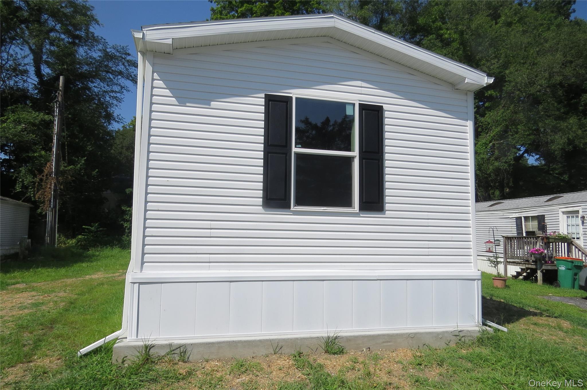723 Beekman Road, Unit 48 Hopewell Junction, NY 12533 - Photo 2 of 14 a view of house with backyard and garden
