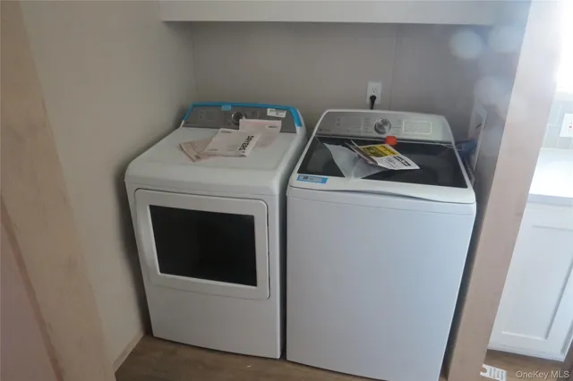 a utility room with dryer and washer