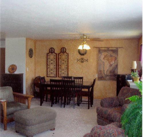 312 Warrior Road Yakima, WA 98901 - Photo 3 of 9 a living room with furniture a dining table and a chandelier