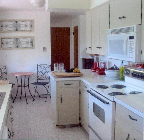 312 Warrior Road Yakima, WA 98901 - Photo 4 of 9 a kitchen with a sink stove and cabinets
