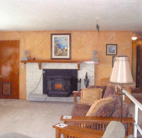 312 Warrior Road Yakima, WA 98901 - Photo 6 of 9 a living room with furniture and a fireplace