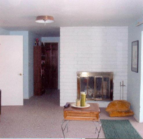 312 Warrior Road Yakima, WA 98901 - Photo 7 of 9 a living room with furniture and a fireplace