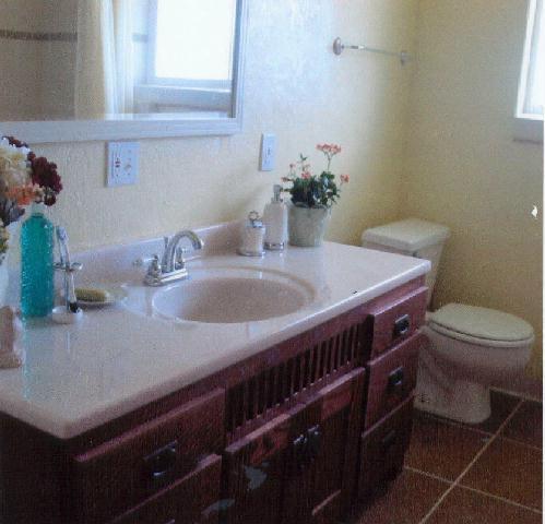 312 Warrior Road Yakima, WA 98901 - Photo 8 of 9 a bathroom with a sink a toilet and with mirror