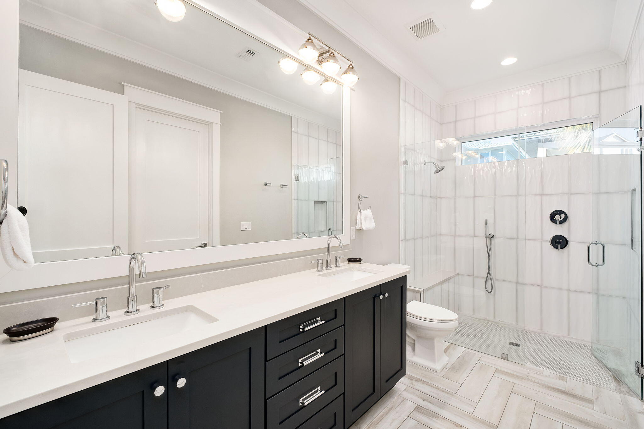 260 Magnolia Street Santa Rosa Beach, FL 32459 - Photo 11 of 19 a bathroom with a double vanity sink a toilet and shower