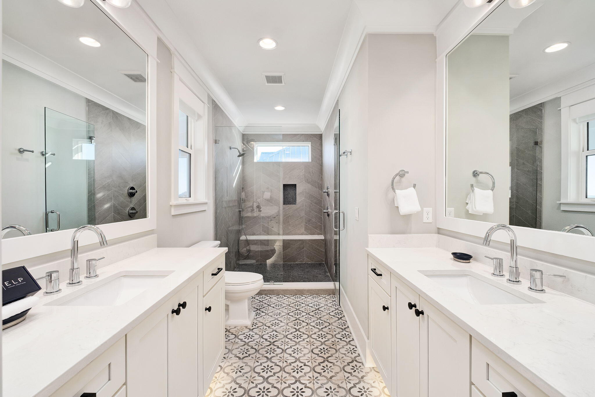 260 Magnolia Street Santa Rosa Beach, FL 32459 - Photo 13 of 19 a spacious bathroom with double sink and a large mirror