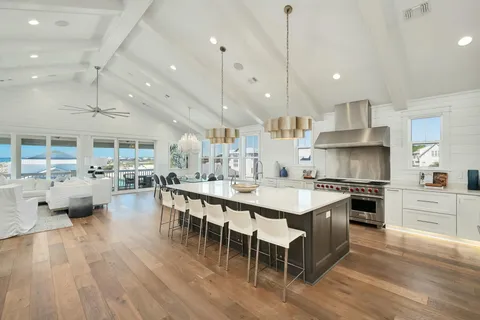a large kitchen with stainless steel appliances lots of counter space and a center island