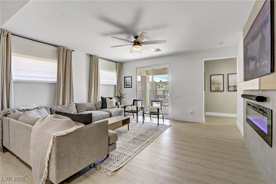 2835 Strathallan Avenue Henderson, NV 89044 - Photo 10 of 64 Living area with ceiling fan and light wood-style flooring