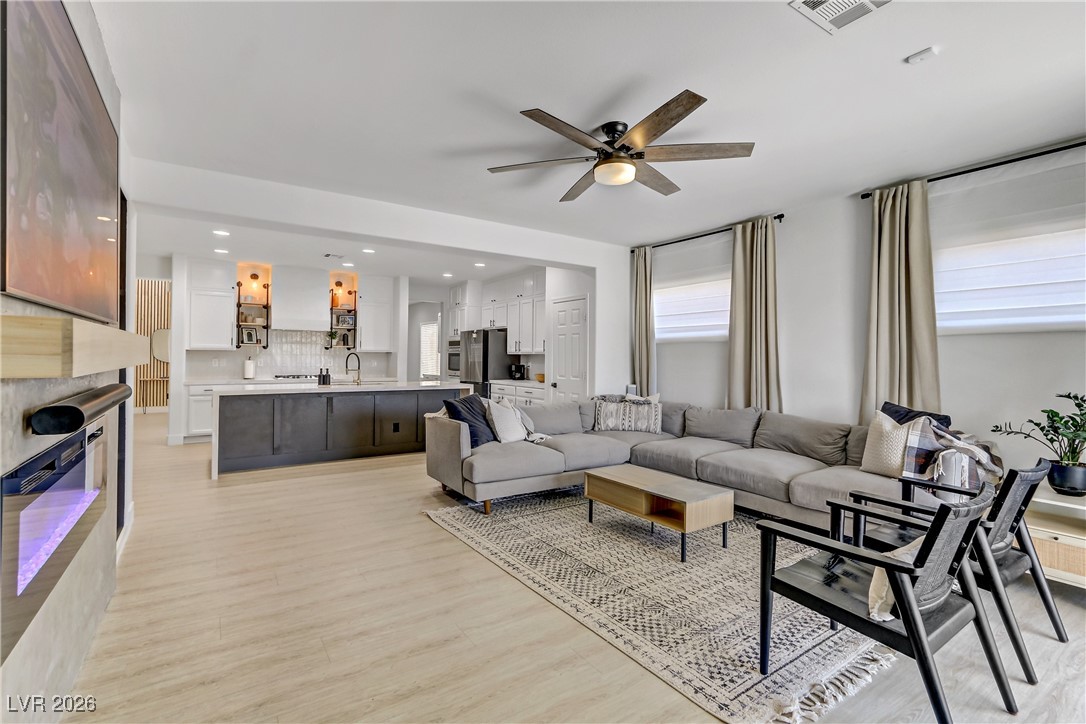 2835 Strathallan Avenue Henderson, NV 89044 - Photo 12 of 64 Living room featuring recessed lighting, light wood-type flooring, and ceiling fan