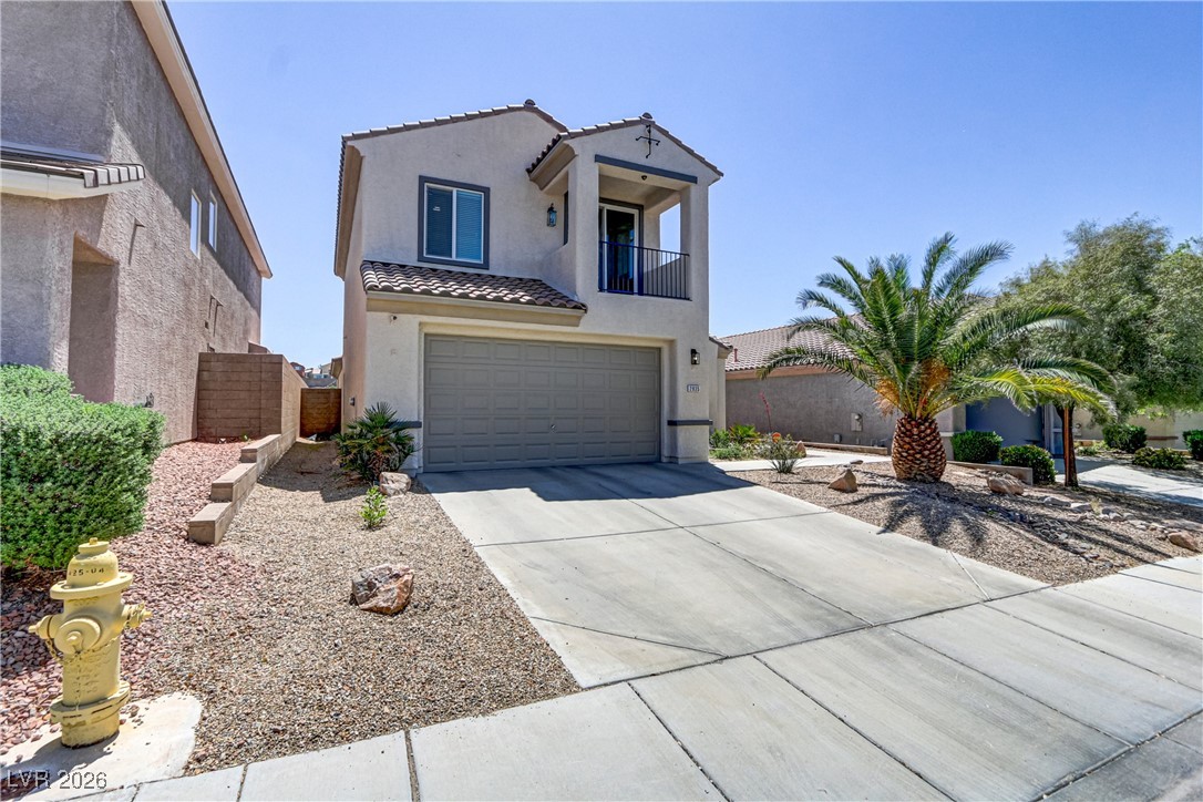 2835 Strathallan Avenue Henderson, NV 89044 - Photo 42 of 64 Mediterranean / spanish-style house with a balcony, a garage, stucco siding, driveway, and a tiled roof