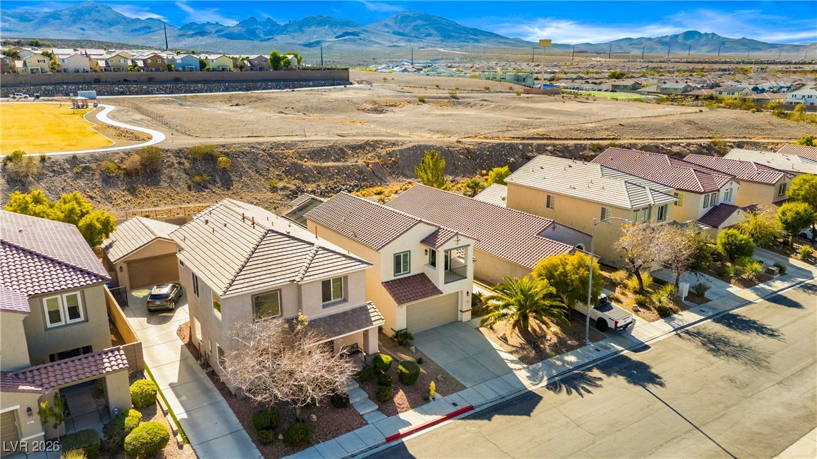 2835 Strathallan Avenue Henderson, NV 89044 - Photo 51 of 64 Aerial view of residential area featuring a mountain backdrop