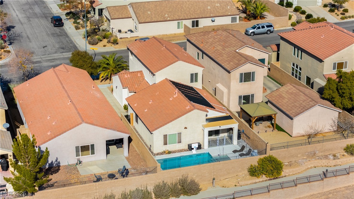 2835 Strathallan Avenue Henderson, NV 89044 - Photo 58 of 64 Aerial perspective of suburban area featuring a pool