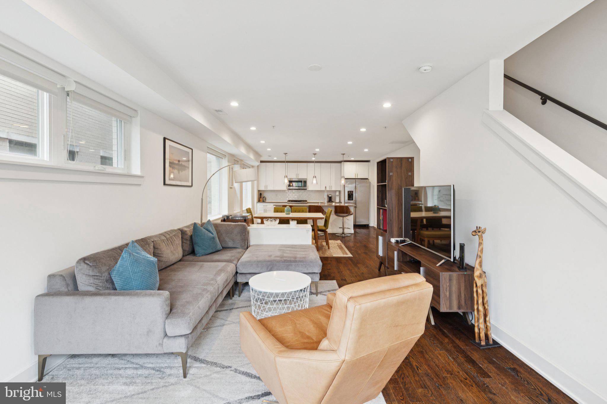1022 South 2nd Street, Unit 2 Philadelphia, PA 19147 - Photo 13 of 46 a living room with furniture and a view of kitchen
