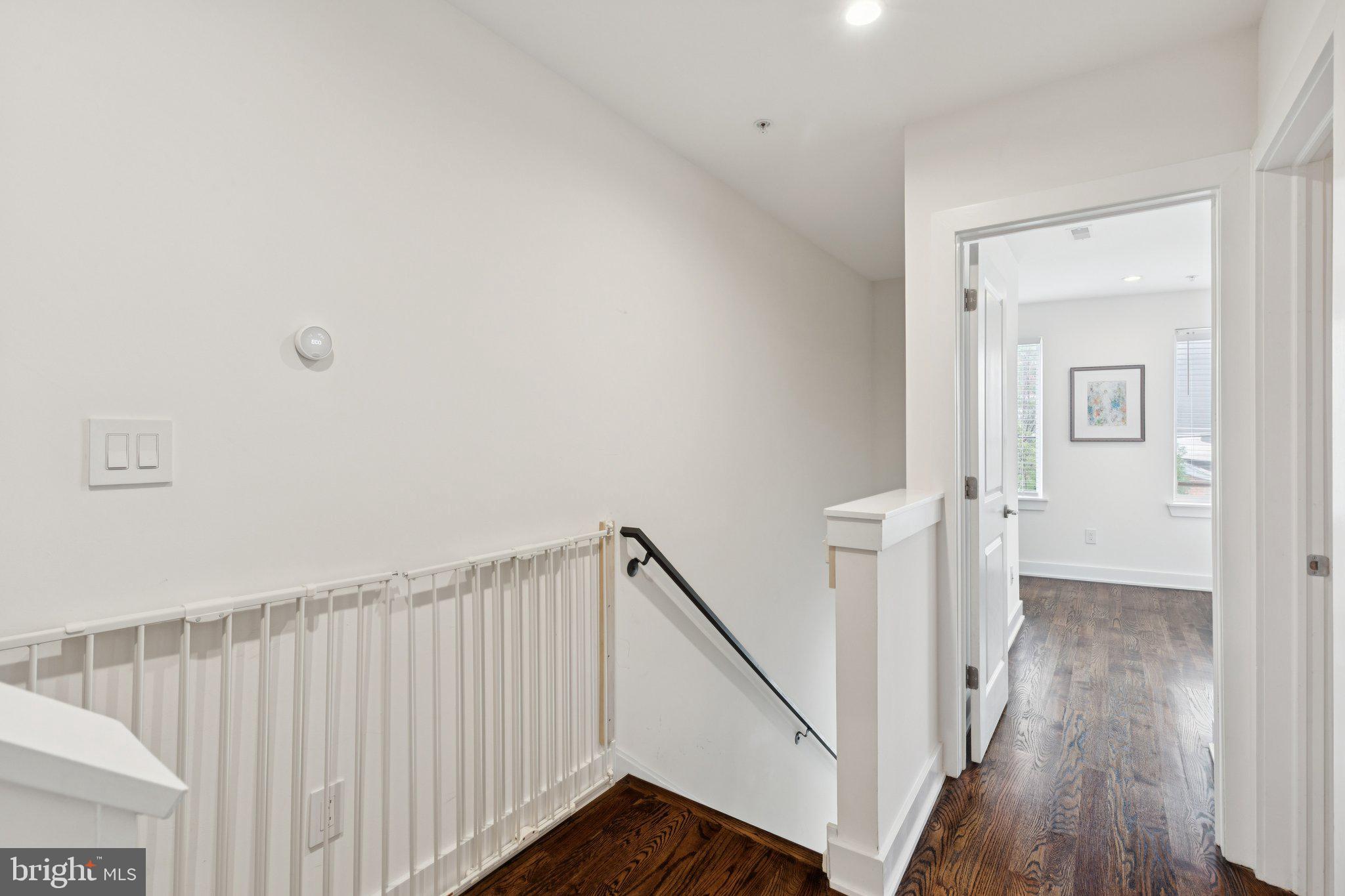 1022 South 2nd Street, Unit 2 Philadelphia, PA 19147 - Photo 15 of 46 a view of a hallway with wooden floor and staircase