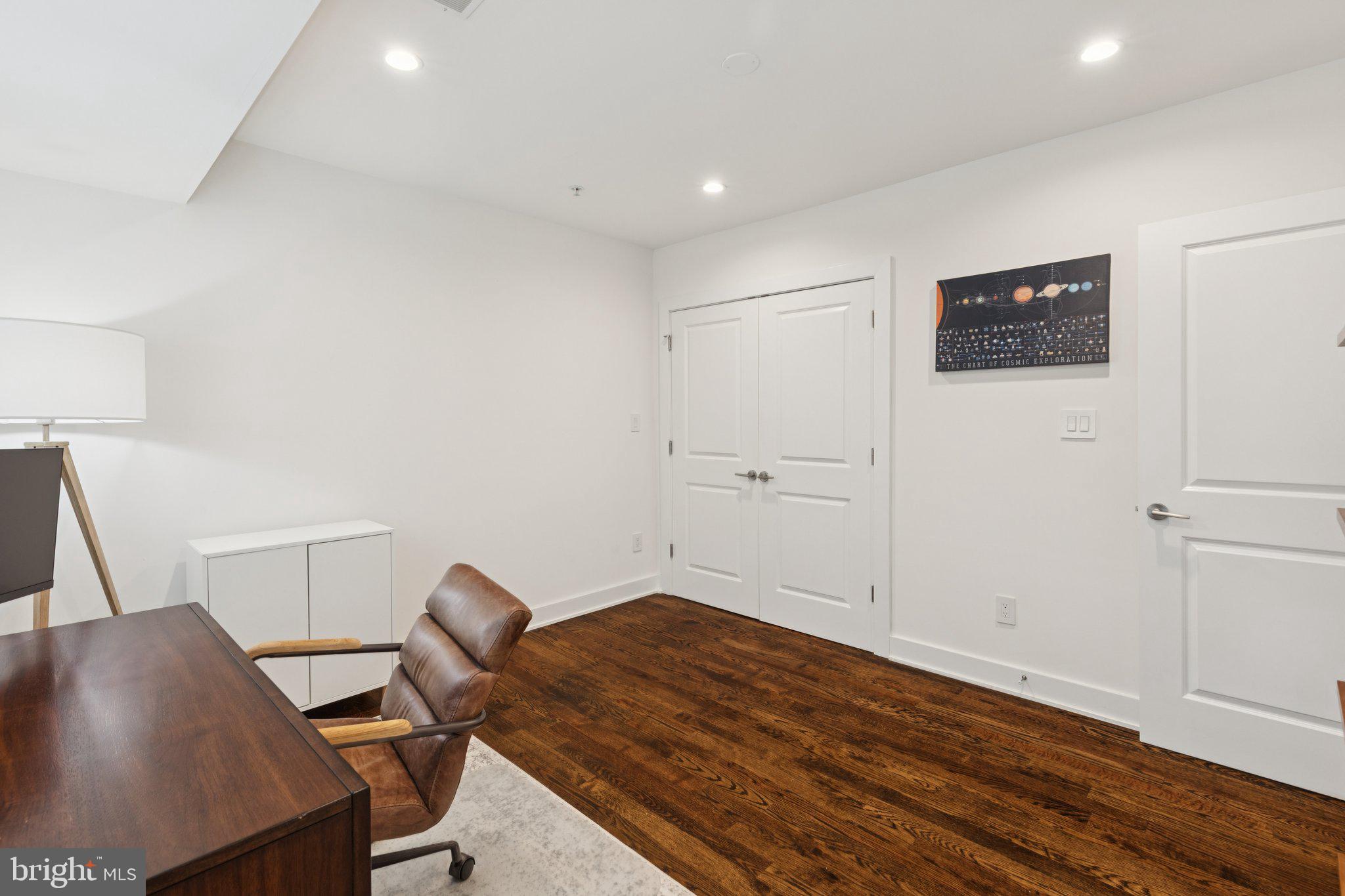 1022 South 2nd Street, Unit 2 Philadelphia, PA 19147 - Photo 23 of 46 a room with a chair and wooden floor