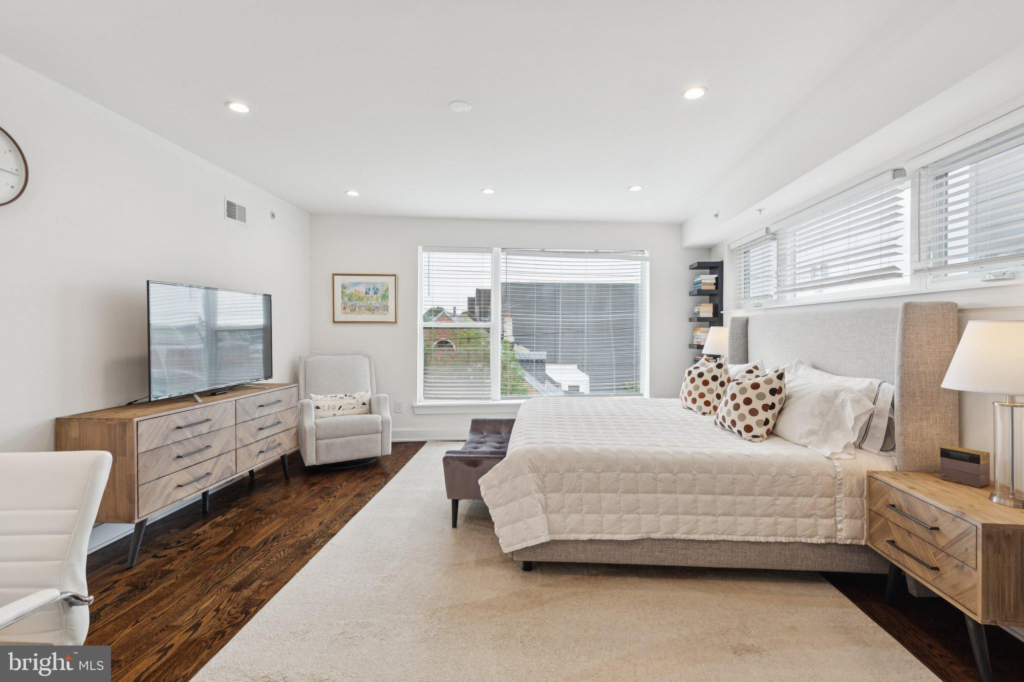 1022 South 2nd Street, Unit 2 Philadelphia, PA 19147 - Photo 27 of 46 a bedroom with a bed couch and window