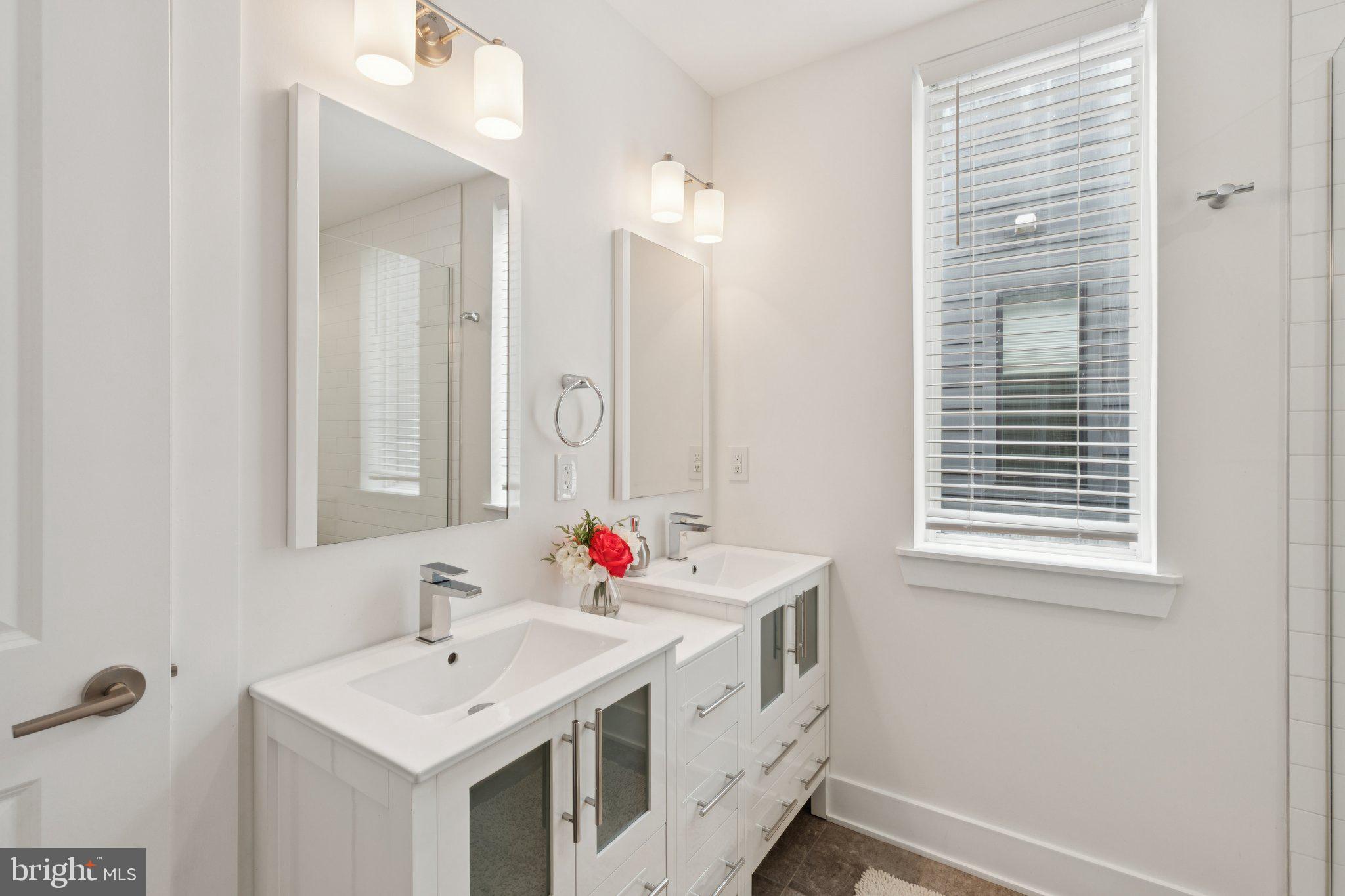 1022 South 2nd Street, Unit 2 Philadelphia, PA 19147 - Photo 32 of 46 a bathroom with a sink and a mirror