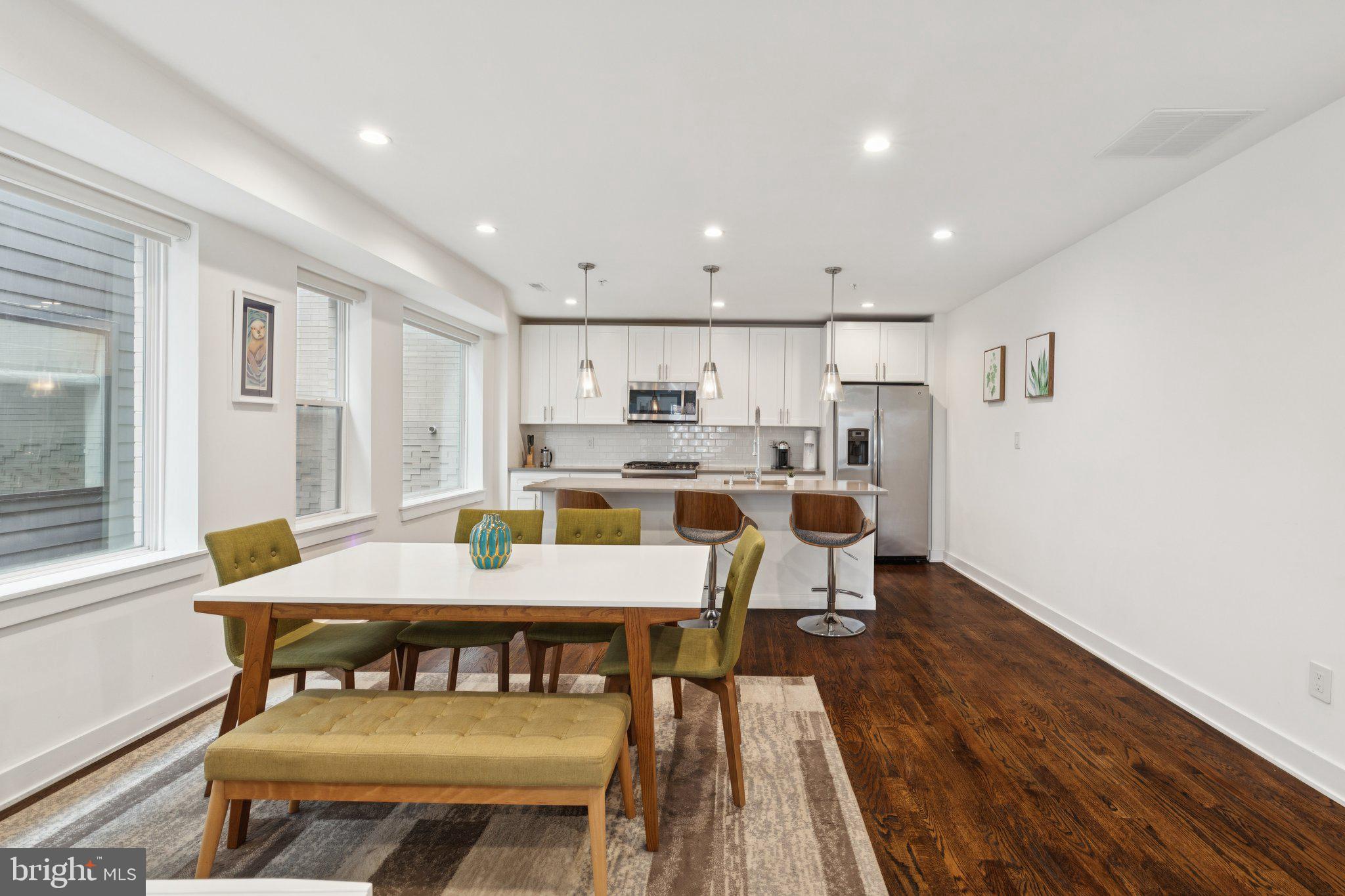 1022 South 2nd Street, Unit 2 Philadelphia, PA 19147 - Photo 10 of 46 a view of a dining room with furniture and wooden floor