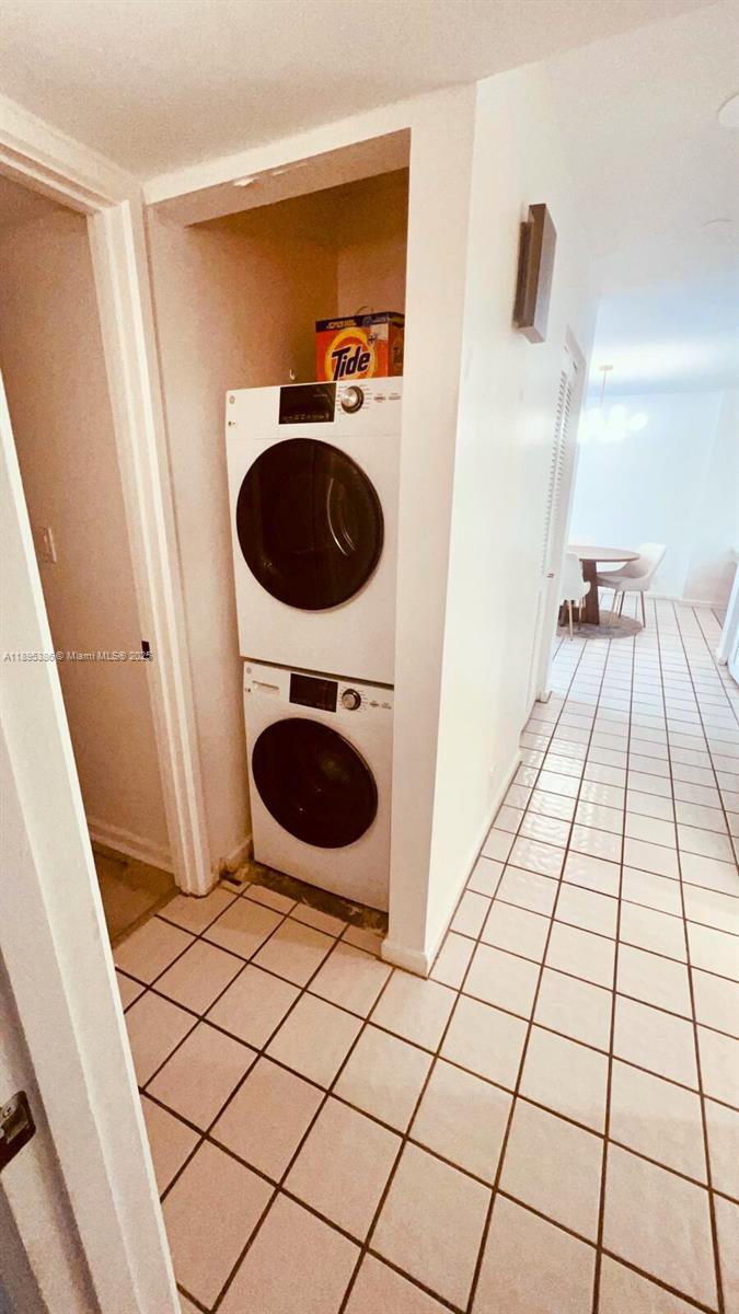 170 Ocean Ln Drive, Unit 311 Key Biscayne, FL 33149 - Photo 14 of 32 a view of a bathroom with a sink and a mirror