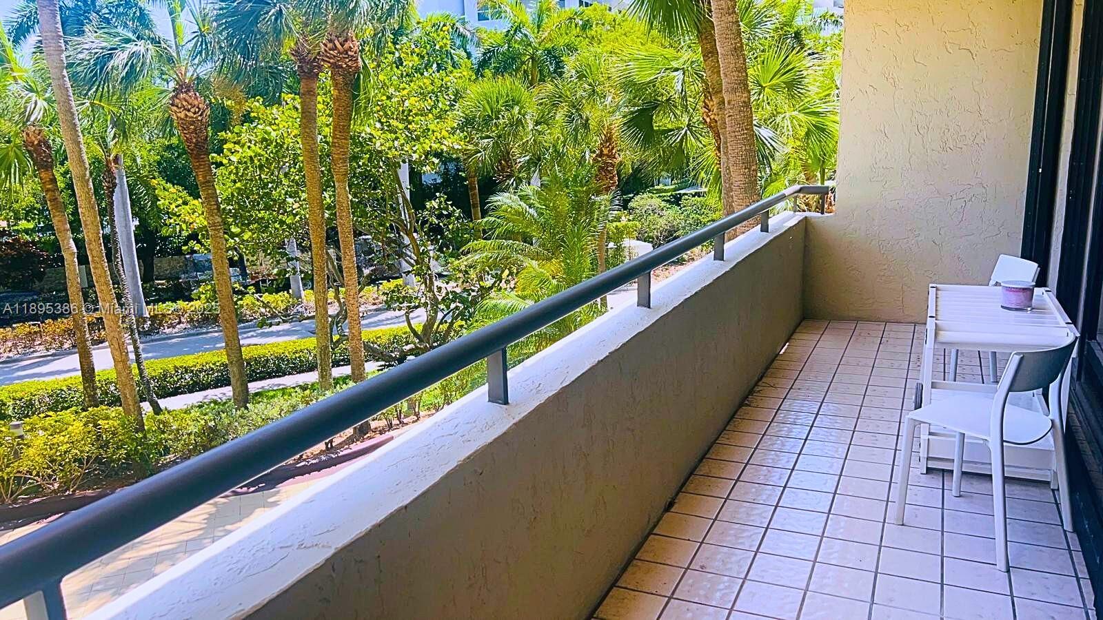 170 Ocean Ln Drive, Unit 311 Key Biscayne, FL 33149 - Photo 15 of 32 swimming pool view from a balcony