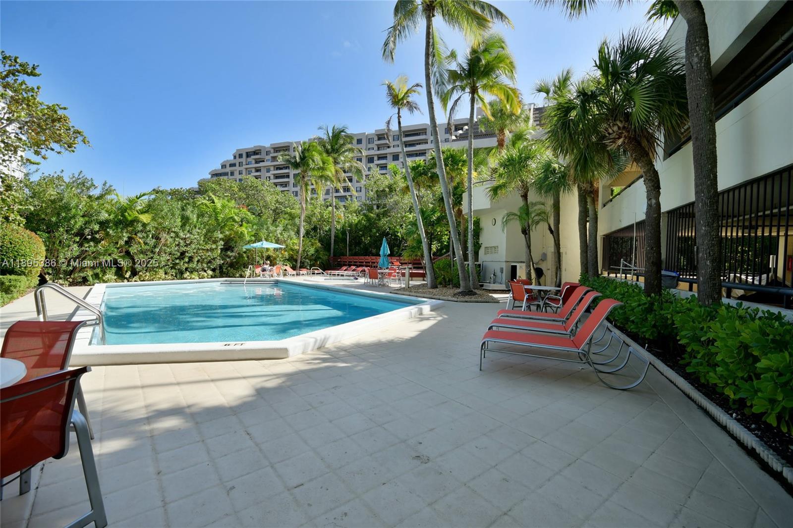 170 Ocean Ln Drive, Unit 311 Key Biscayne, FL 33149 - Photo 18 of 32 a view of a park with bench and trees