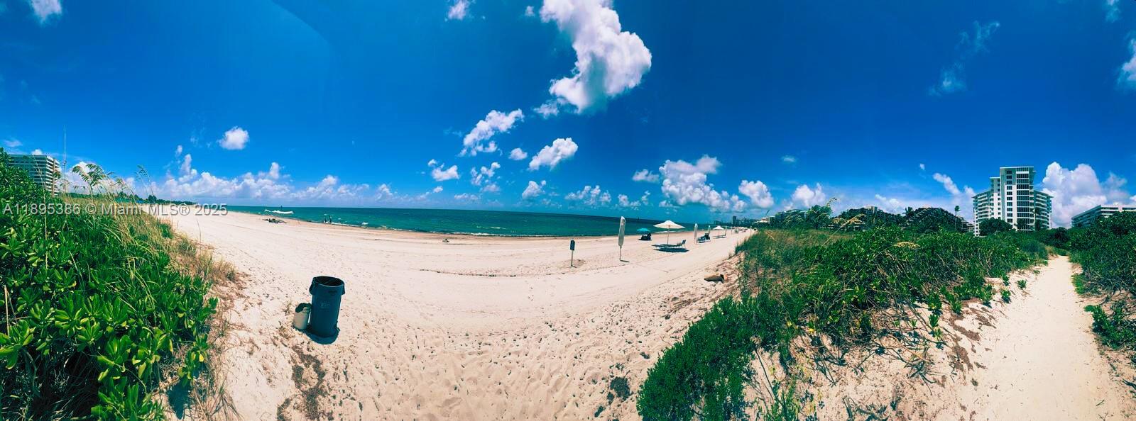 170 Ocean Ln Drive, Unit 311 Key Biscayne, FL 33149 - Photo 26 of 32 a view of a building with a yard